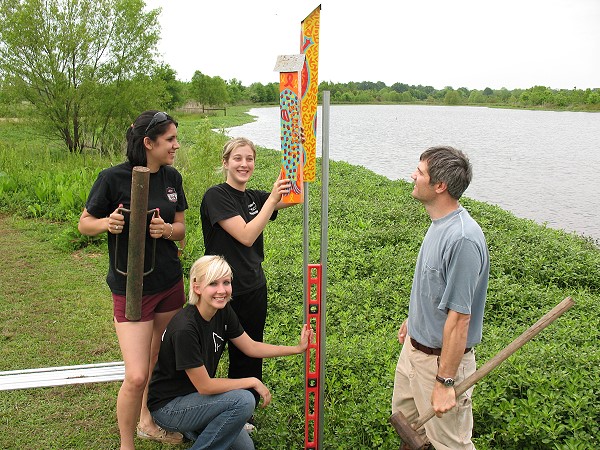 Judson College art students installing their art sticks 