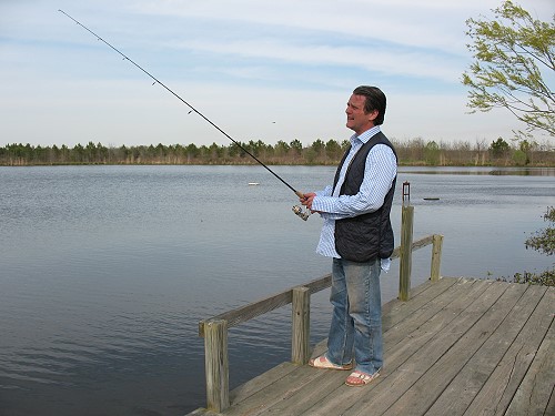 Jerry fishing from a pier