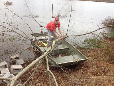 Hudson Wilson (Manager Wilson's grandson) adding tree structure to Sturdivant Lake...Dec. 2012