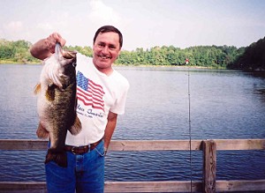 Randal Cowart with 14 lb 1 oz bass caught from Lake Ely, 2000